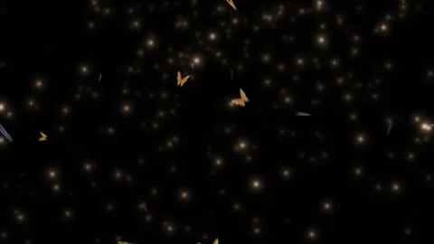 Golden bokeh lights on black background. Abstract glowing particles floating in Vídeos de archivo 339646441