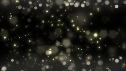 Golden bokeh lights on black background. Abstract glowing particles for festive Video stock 339646483