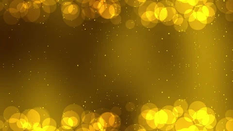 Golden bokeh lights create a stunning frame on a dark gold background.  Stock Footage 294024633