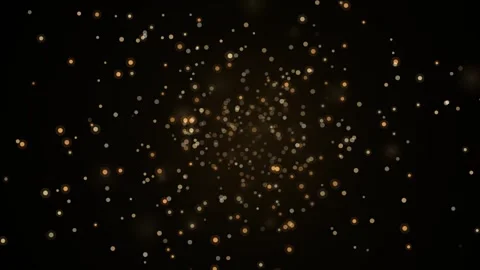Golden Bokeh Particles Exploding in Darkness Creating a Magical Festive Atm.. Stockbeeldmateriaal 347369697