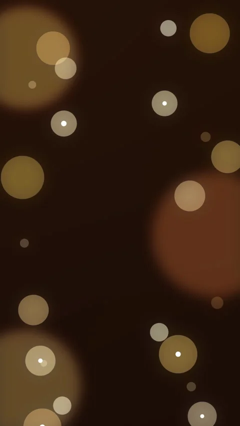 Golden bokeh particles floating and shining on dark background loop Stock Footage 346738476