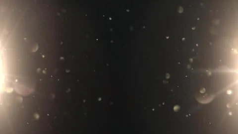 Golden Bokeh Particles Floating with Lens Flare Overlay on Dark Background Stock Footage 337228644