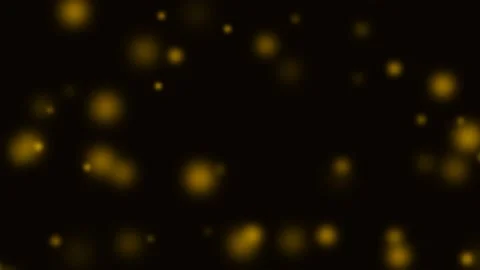 Golden bokeh particles floating softly across a deep black background Video stock 335117965