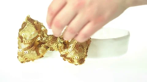 Golden bow headband Stock Footage 74135295