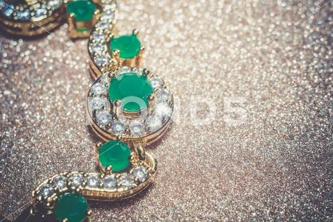 Golden Bracelet with Emerald Filtered Stock Photos