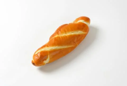 Golden braided bread on plain background Foto stock