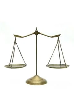 Golden brass scales of justice on white Stock Photos