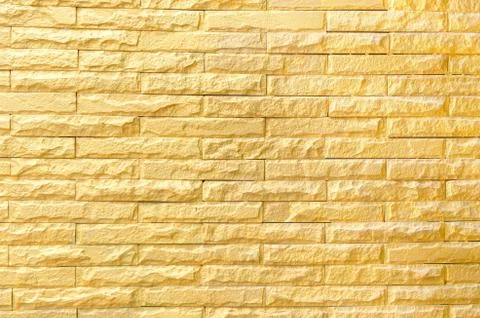 Golden brick wall background pattern texture Stock Photos