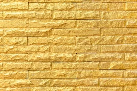 Golden brick wall background pattern texture Stock Photos