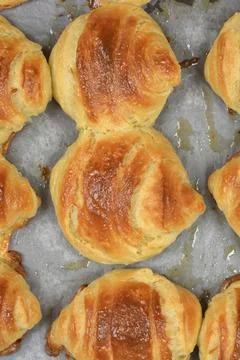 Golden Brown Baked Pastry on Baking Paper Stock Photos