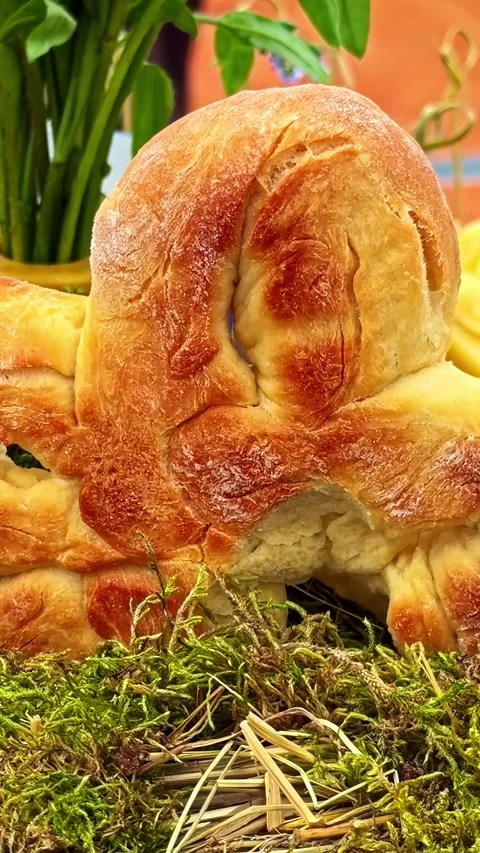 A golden brown, freshly baked Easter bunny sourdough bread loaf. Stock Footage 344526101