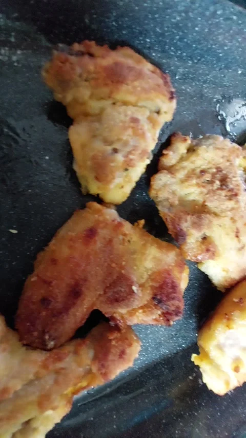 Golden brown fried schnitzels on a baking tray Stock Footage 334393182