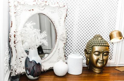 A golden Buddha head on a table. Stock Photos