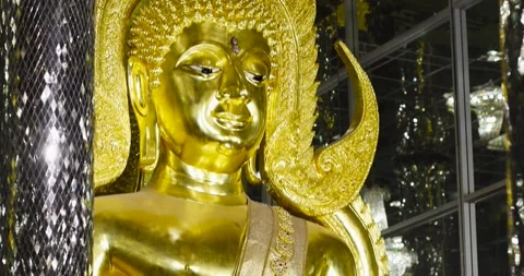 Golden Buddha statue inside a Buddhist temple. Elegant sacred architecture .. Stock Footage 340225227