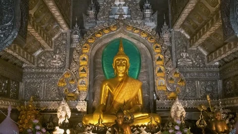 Golden Buddha statue inside elaborately decorated Silver Temple interior with Stock Footage 315856348