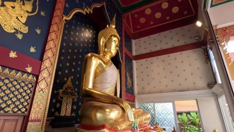 Golden Buddha statue seated in Buddhist temple in Bangkok Stock Footage 339977751