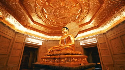 Golden Buddha Statue Seated Under Ornate Gilded Ceiling in Bai Dinh Pagoda Vídeo Stock 331032989