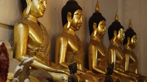 Golden Buddha statues in temple, symbolizing faith, peace, and Thai culture Video stock 328218238