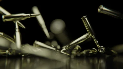 Golden Bullets falling down on a reflect... | Stock Video | Pond5