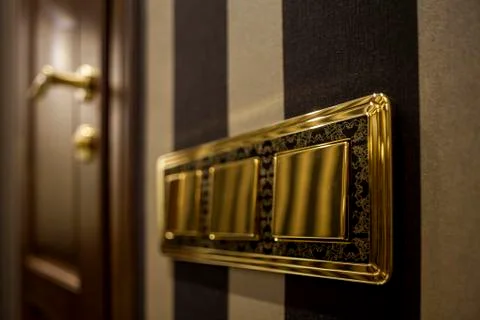 Golden button Light Switch Stock Photos