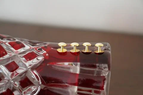 The golden buttons are on the vase. Stock Photos