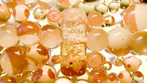 Golden Capsule Pill with Micro Particles Surrounded by Transparent Bubbles Stock Footage 317296516