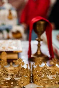 Golden Chalice and Sacred Objects in Eastern Orthodox Church Ritual, Red Cl.. Stock Photos