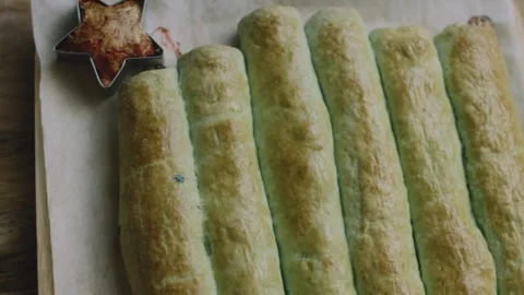 Golden cherry rolls displayed with a baked red star Stock Footage 342129143