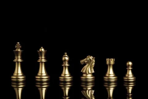 Golden chess include king queen horse ship and pawn on black background Stock Photos