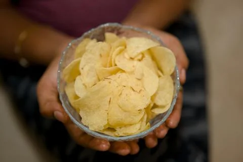 Golden Chips in Hand Stock Photos