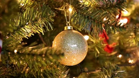 Golden Christmas ball on the tree with blinking lights Video stock 83655575