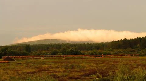 Golden cloud over the mountain Stock Photos