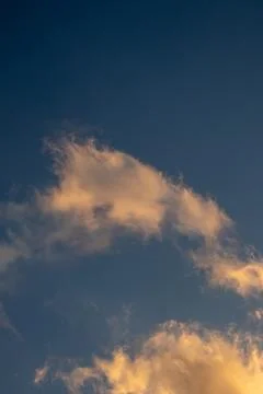 Golden Clouds Against a Deep Blue Sky Photos