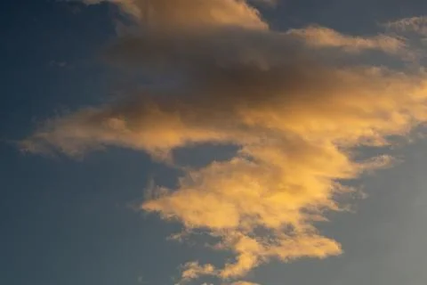 Golden Clouds in a Blue Sky Fotos de archivo