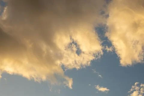 Golden Clouds in a Blue Sky Stock Photos