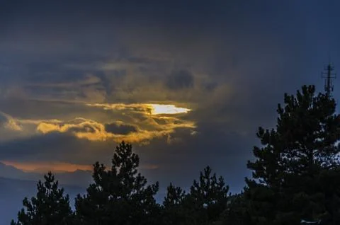 Golden clouds over the mountain. Stock Photos