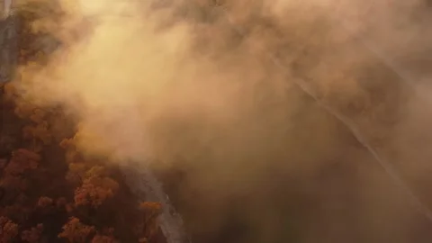 Golden clouds over river from above Stock Footage 312041749