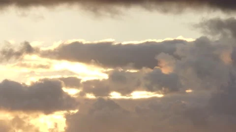 Golden clouds with sun behind - Time Lapse Sky - natural Cloudscape Stock Footage 139397861