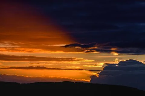 Golden clouds at sunset Stock Photos