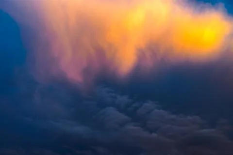 Golden clouds at sunset Stock Photos