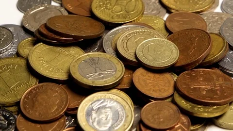 Golden coins of different countries on the table Stock Footage 82485056