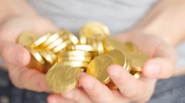 Golden coins in hands Stock Footage 85961805