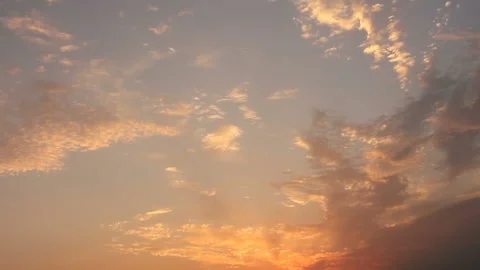 Golden colored clouds in the twilight Stock Footage 104720863