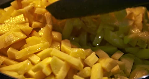 Golden-colored potatoes fried in pan in sunflower oil. Potatoes cut into strips Stock Footage 233784751