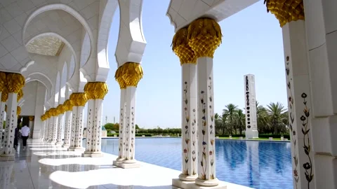 Golden Columns by the Tranquil Blue Pool Stock Footage 312051961