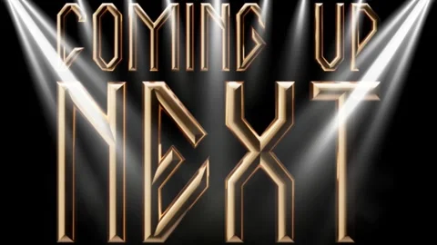 Golden coming up next text motion graphics with bright stage spotlight beams Видео 345102028