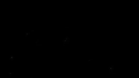 Golden confetti particles falling against black background Stock-Footage 337534032