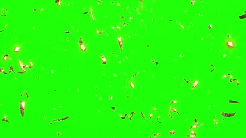Golden confetti particles falling downwards against a vibrant green screen Stock Footage 338314568