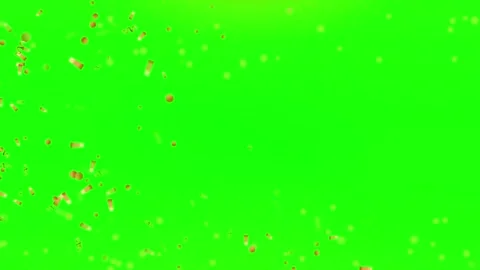 Golden confetti particles falling downwards against a vibrant green screen Vídeos de archivo 344647323