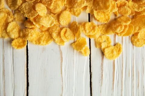Golden crisp cereal for Breakfast on a white wooden background Stock Photos